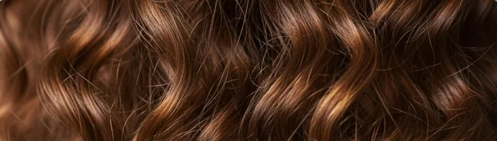 Loose brown curls, close up