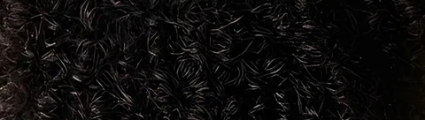 Tight dark coils, close up